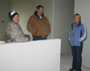 McNutt and Bawek visit with Mayor Craig Schroeder inside the triplex-in-progress.