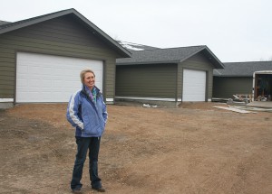 LeAnne Bawek stands in front of Doland's triplex.