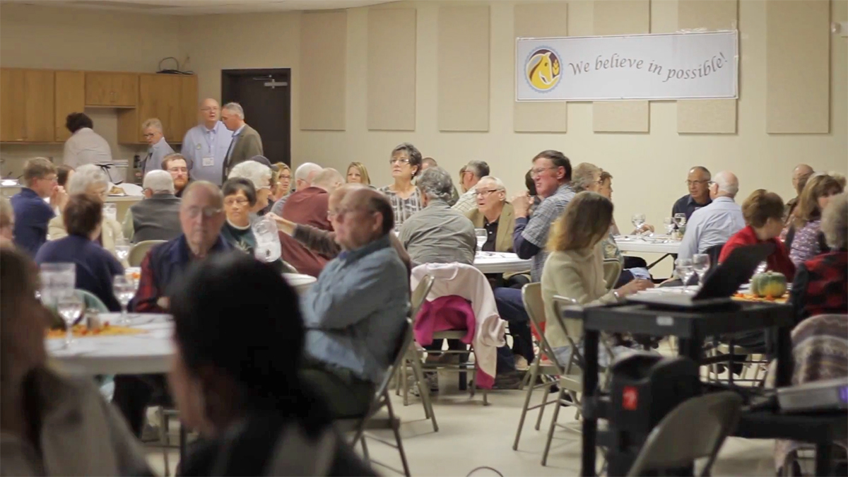 Members of the Faulkton community gathered in December 2013 to celebrate the community’s development efforts, including supporting their entrepreneurs participating in the Dakota Rising program. Photo from a Dakota Resources video.