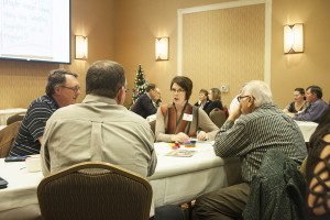 Kristin Brekke Vandersnick, center, discusses regional efforts at the Prairie Idea Exchange on Dec. 9. Photo by Heidi Marttila-Losure