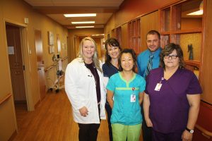 Douglas County Memorial Hospital’s success as a minority independent health care organization lies within its board of directors’ foresight and investments, according to Administrator Heath Brouwer, pictured with (back row, from left) Physician Assistant Amber Wolter, Registered Nurse Pam Blume, (front row) Registered Nurse Annie Rolston and Certified Nurse Aide Jody Wright.