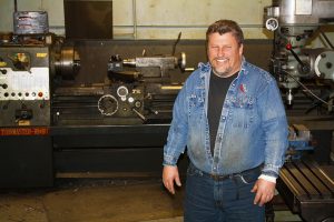 Collin Newton, owner of Parkston Precision Manufacturing in Parkston, S.D., has found it difficult to hire a person with the right skill set to help in his business. Photo by Wendy Royston