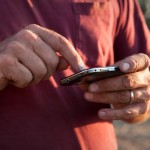 Farmer using smart phone