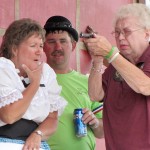 Trial by marksmanship for Dead-Eye Millie Hansen resulted in a “surprise” guilty verdict. Keeping an eye on where she pointed the gun are Susan and Kirk Schaefers. The drama was part of the Orient, S.D., 125th Celebration July 6-8. Photo by Faulk County Record