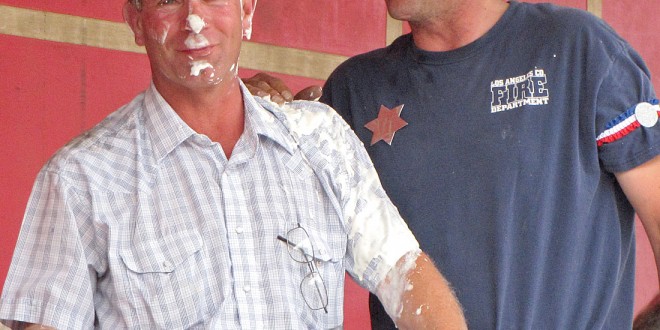 Terry Huss did just to good a job on his 125th celebration duties to suit the kangaroo court officials and received a pie in the face for his efforts. Photo by Faulk County Record