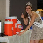 South Dakota Snow Queen Aly Perry, a Frederick High School graduate, helps with serving drinks at the community dinner June 15 during Finn Fest in Frederick, S.D. Photo courtesy fredericksd.com