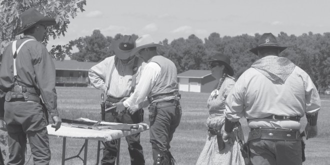 Participants get ready for the next round at Cowboy Action Shooting in Clark, S.D.