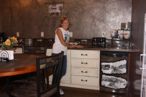 Sherie Tellinghuisen in a kitchen area in the Home Town Hotel in Willow Lake. Photo by Clark County Courier