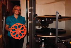 The reel that Jen Carstensen is holding is how new movies come to the Bryant Cinema. Clark County Courier photo