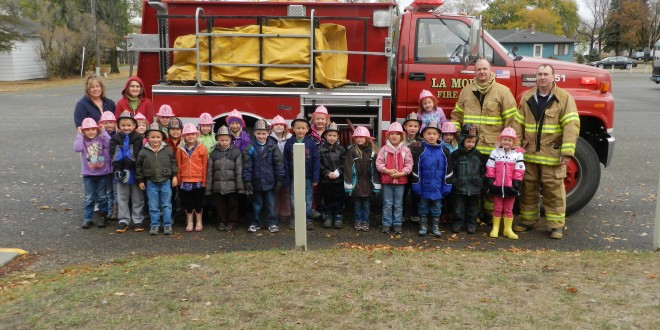 Firemen visted the LaMoure school to talk with the kindergarten class about fire prevention. Photo by LaMoure Chronicle.