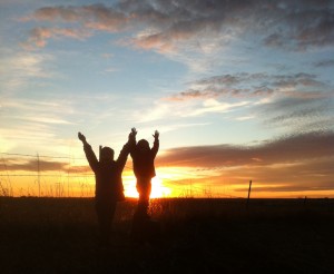 Silhouetted kids in Dakota sunset. Photo by Heidi Marttila-Losure
