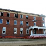 A fence keeps people back from the crumbling Waldorf Hotel in Andover, S.D. Photo by Troy McQuillen