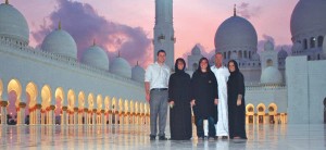 Josh Wagner and Art Steiner are pictured with Lori, Andrea and Karli Opitz garbed in burkas at the Grand Mosque. A dress code was enforced here, and women were required to cover their hair. Photo by (Webster) Reporter & Farmer