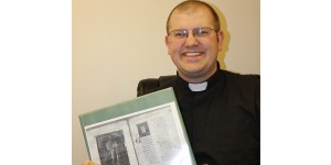 The Rev. Tim Koch, showing his master's thesis project. Photo by Faulk County Record