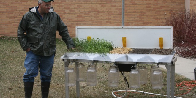 Jeff Hemenway, soil quality specialist for the NRCS, explains how the rain simulator works at an event in Brookings in April 2012. Photo by Heidi Marttila-Losure