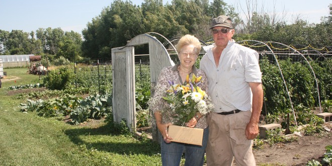 Delores and Nelson Bloomquist have been participating in the local farmers market since 1997 selling everything from flower bouquets, shown above, to tomatoes, potatoes, decorative corn and pumpkins and every vegetable that can be grown in South Dakota as well as raspberries and apples. Photo by Kimberly Harrington/Clark County Courier