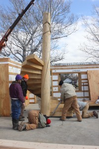 A home being constructed by Ross Hansen (left rear) and Pfeifer & Son Construction in Faulkton will feature a number of unconventional designs and materials, such as this spiral staircase. “The tree it’s cut from was a spruce that was 70 feet tall and was downed in 2007 by fire kill,” Hansen said in October 2012, when they were working on this staircase. “I milled it in 2008. It was about 80 years old… The center pole has a metal core base that goes into the floor, and each of the stairs was cut to be driven into the wood and held by epoxy.” Photo by Garrick Moritz/Faulk County Record