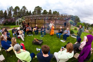 The Rural Art and Culture Summit in Morris, Minn., in June drew people from all over the region to discuss how the arts could be leveraged to create vibrant communities. One evening gathering took place outside, despite cool June temperatures. Photo by Holly Diestler