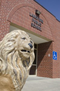 One of the lions guarding the door of the Langford school. Photo by Troy McQuillen
