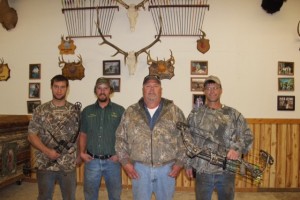 Some of the members of the Bushmen Archery Club, which worked on the renovation of their new clubhouse, are, from left, Wylie DeLange, Isaac Schoenfelder, Mick Schrank and Darwin DeLange. Photo by Douglas County Publishing