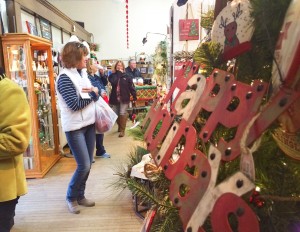 Shoppers take in the holiday displays at Fiksdal Furniture & Gifts during the Jingle & Mingle event on Nov. 21 in Webster. The eight shops that participated were bustling with activity during the six-hour promotion. (Photo by Heidi Marttila-Losure/Dakotafire Media)