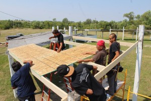 Working together on projects such as this repair of a shelter at local powwow grounds is part of the ethic encouraged by Thunder Valley. Image courtesy Thunder Valley