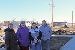The dust of empty lots is proving to be a challenge for the community of Delmont. Pictured are, from left, City Council Member Earla Strid, long-time resident Barbara Hoffman, Mayor Mae Gunnare and Delmont Non-Profit Development Corporation President Darren Fechner. Photo by Elizabeth “Sam” Grosz