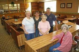 From left, Shirley Jungwirth, Karen Gall, Janette Noyes and Lee Noyes are some of the faces that customers see at Leo’s Good Food. Seated is one of those longtime customers, Juanita Sanger. Photo by Wendy Royston/Dakotafire Media