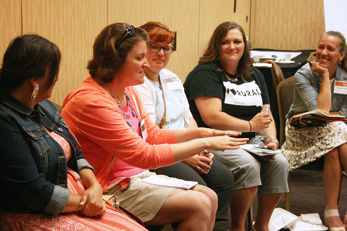 Emily Pieper, second from left, tells her story at RuralX in Aberdeen in July. Pictured with her, from left, are Eileen Briggs, Liz Hannum, Wendy Royston and Angela Tewalt. Photo by Heidi Marttila-Losure/Dakotafire Media