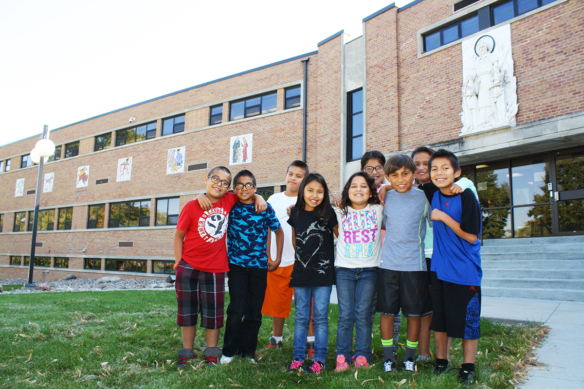 Fourth-graders at St. Joseph’s Indian School share some smiles. Photo by Wendy Royston/Dakotafire Media