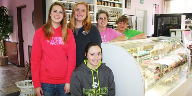 Diane Hepburn (far right) and Trish Meek (second from right), pictured with employees Brandy Melius (in front), Megan Kones (left) and Chloe Brand, say the key to business in a small town is diversity. The duo has sold baked goods, gourmet candies, coffees, and lunch specials at Muffin Tops—and gift items on the lower level Muffin Bottoms—in downtown Faulkton, S.D., since this summer. Photo by Wendy Royston