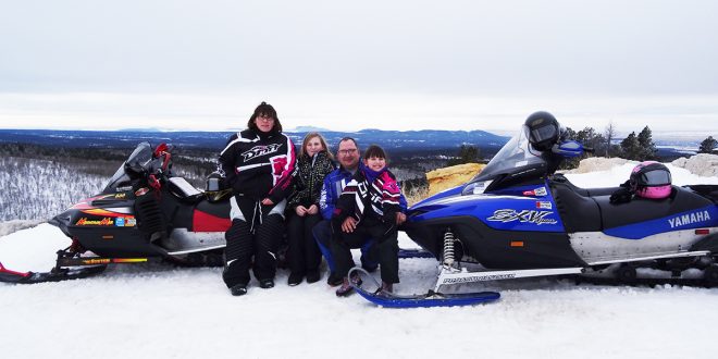 Snowmobiling and other winter activities have become a family tradition for the Juhnke family of Parkston, S.D.—parents Nicole and Jason, and children Cadence, 12, and Rory, 9.  Courtesy photo